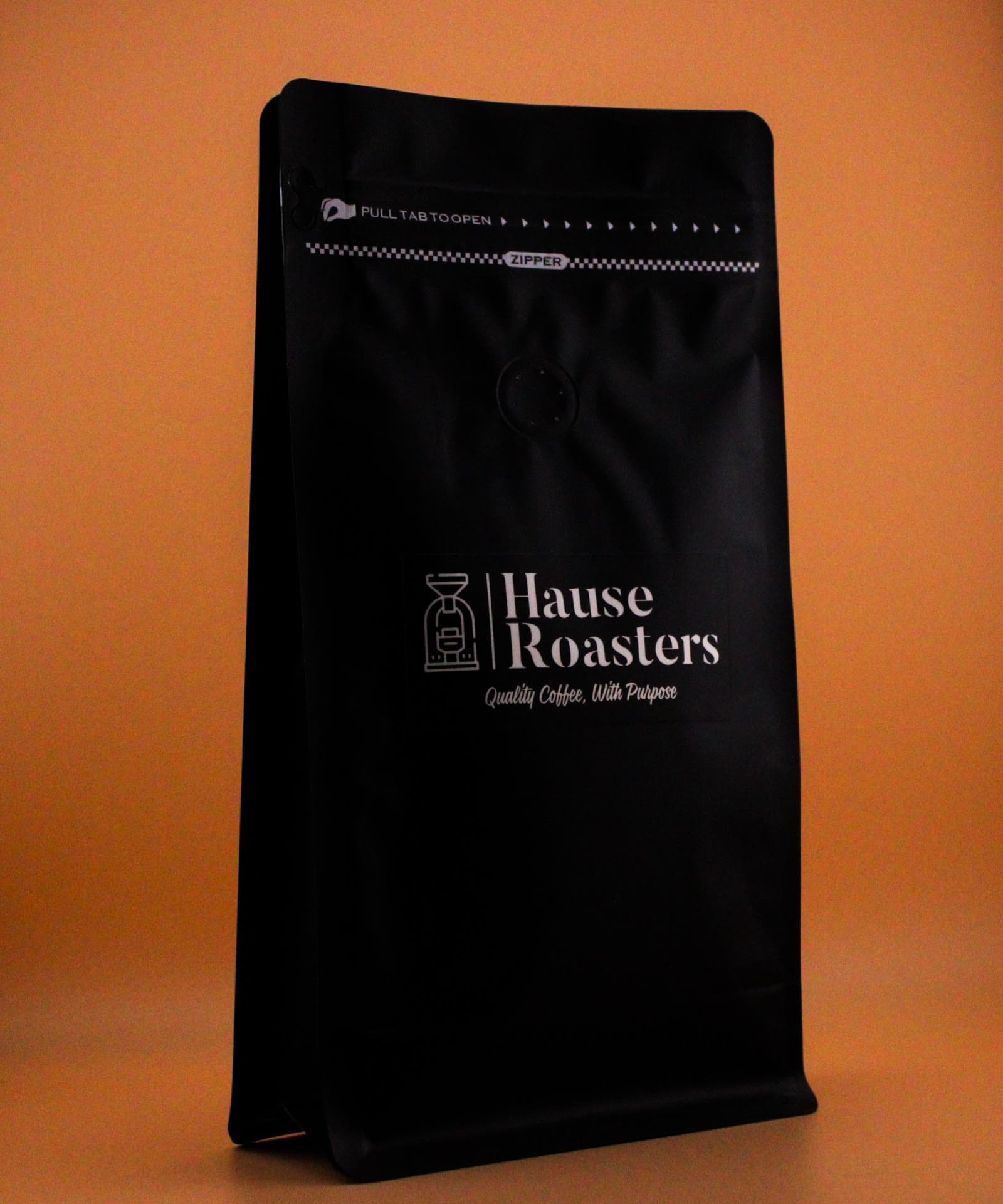 Finca Dos Quebradas Hause Roasters bag on a warm studio backdrop